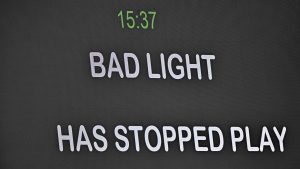 Message telling spectators bad light has stopped play is shown on the big screen