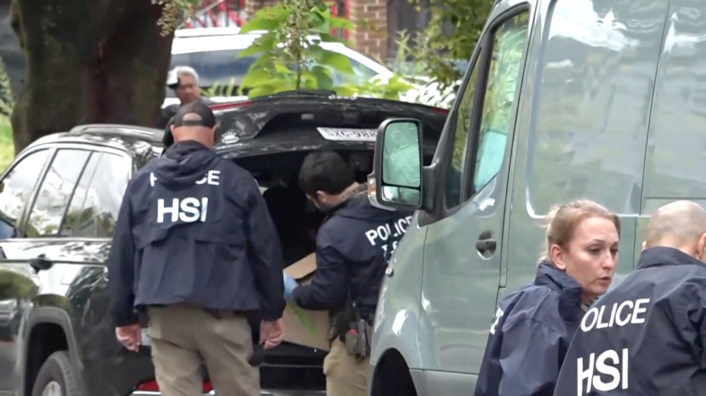 HSI agents with boxes outside Ilhan Omar's home.