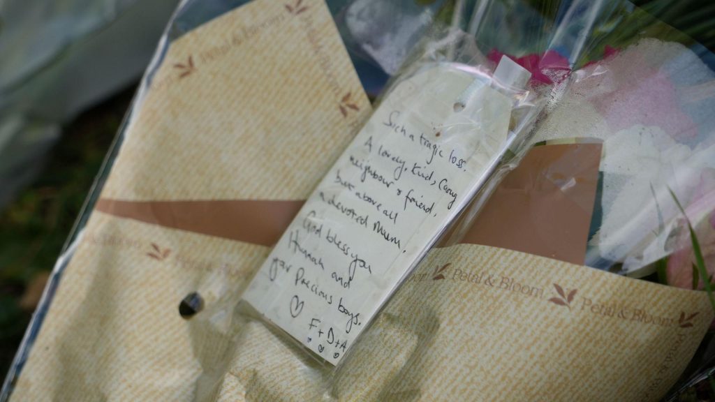 A bouquet of flowers with a note on it that reads: "Such a tragic loss, a lovely, kind and caring neighbour and friend but above all a devoted mum. "God bless you Hannah and your precious boys."